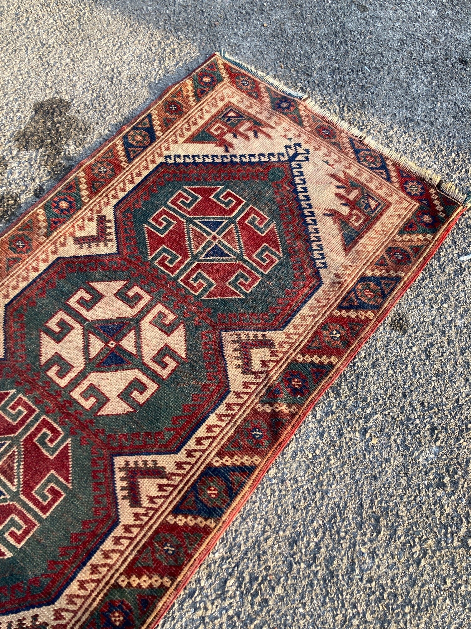 A Caucasian design green ground runner, 340 x 76cm